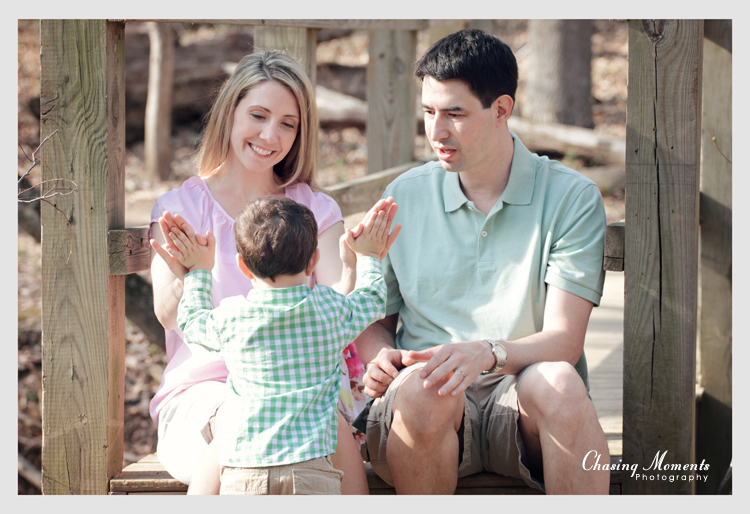 Parents having fun with son, outdoor portrait family photography session in Northern Virginia
