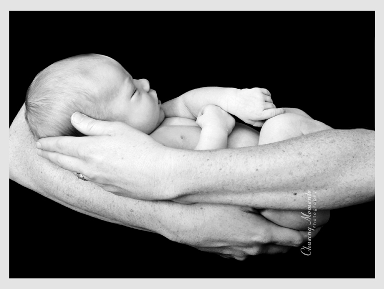 newborn baby in mothers hands