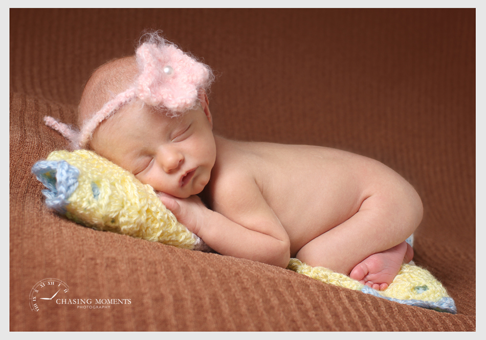 professional posed picture of newborn baby asleep