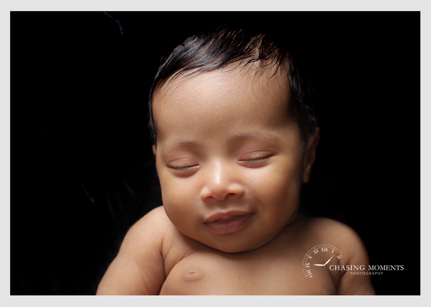 newborn baby asleep smile professional photographer nova