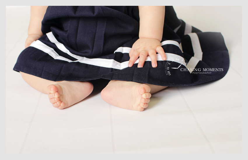 baby feet on white wood planks floor professional photo studio in mclean va