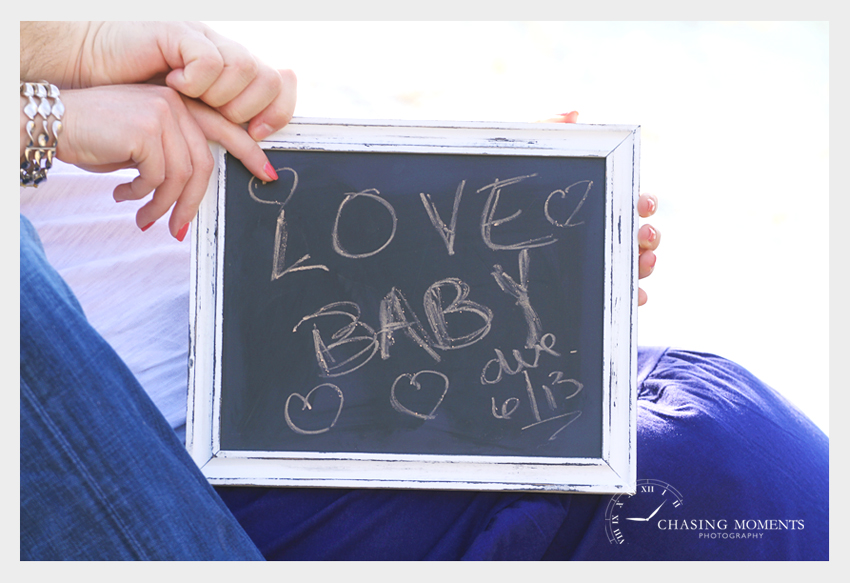pregnancy photo shoot due date written on chalk board picture frame 